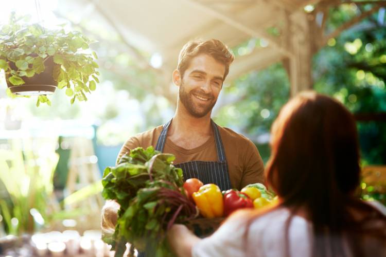 A farmer sells produce at a St. Augustine market